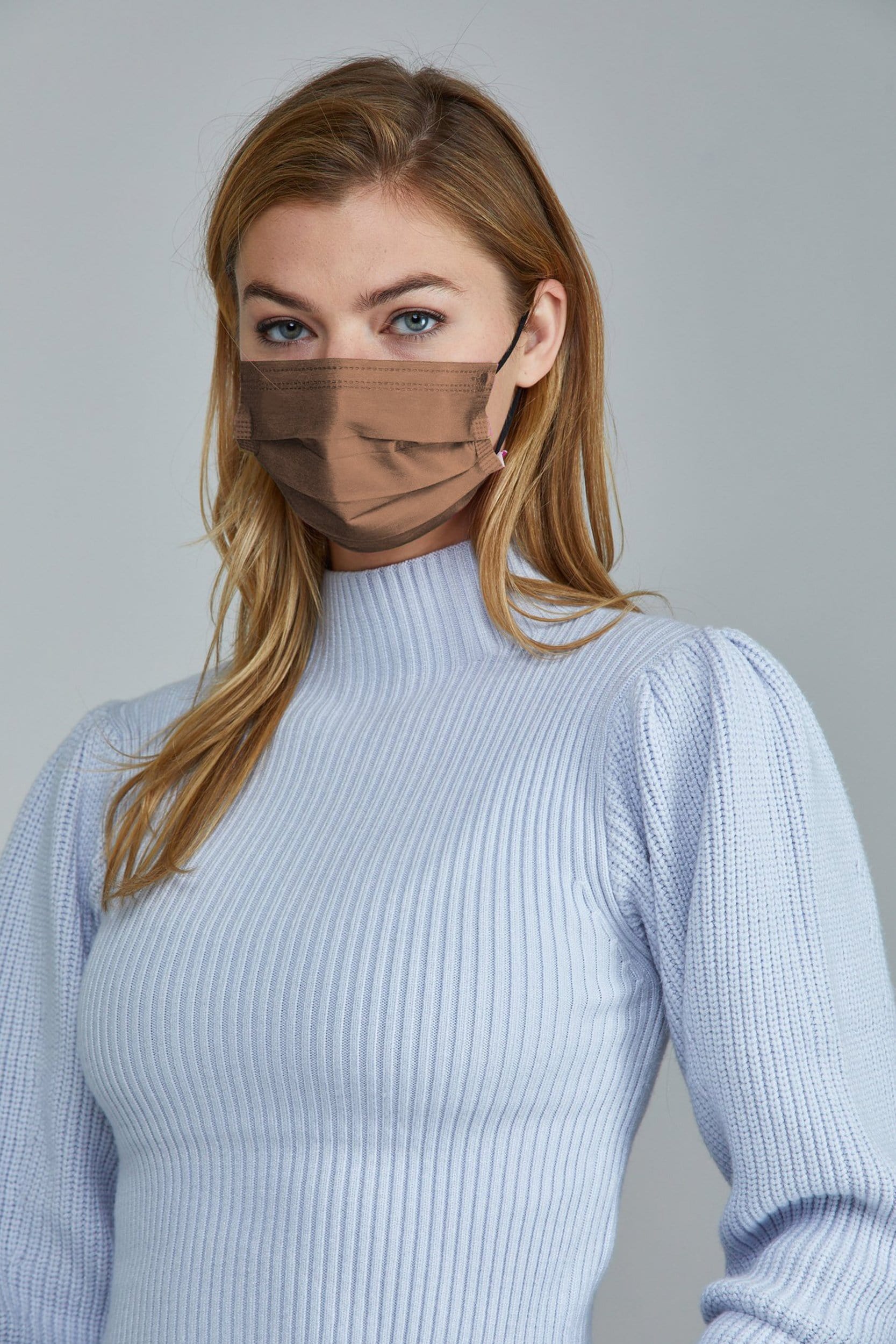 Woman wearing stylish Brown Pleated face mask, with high quality breathable fabric. 