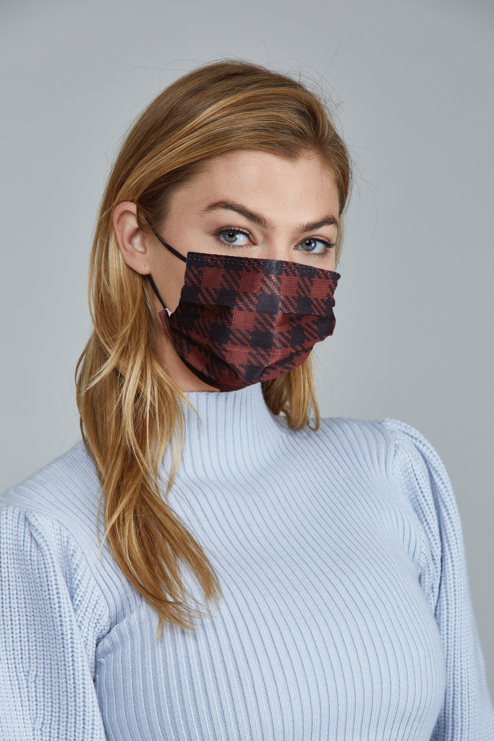 Woman wearing stylish Red Plaid Printed Pleated face mask, with three layers & high quality breathable fabric. 