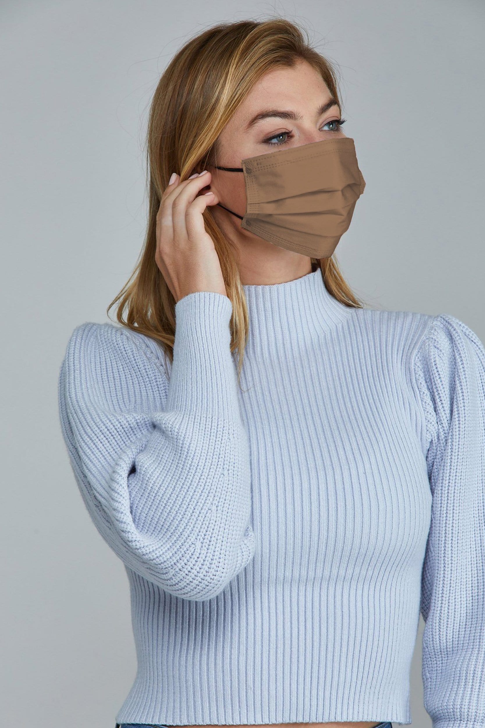 Woman wearing stylish Taupe Pleated face mask, with high quality breathable fabric. 
