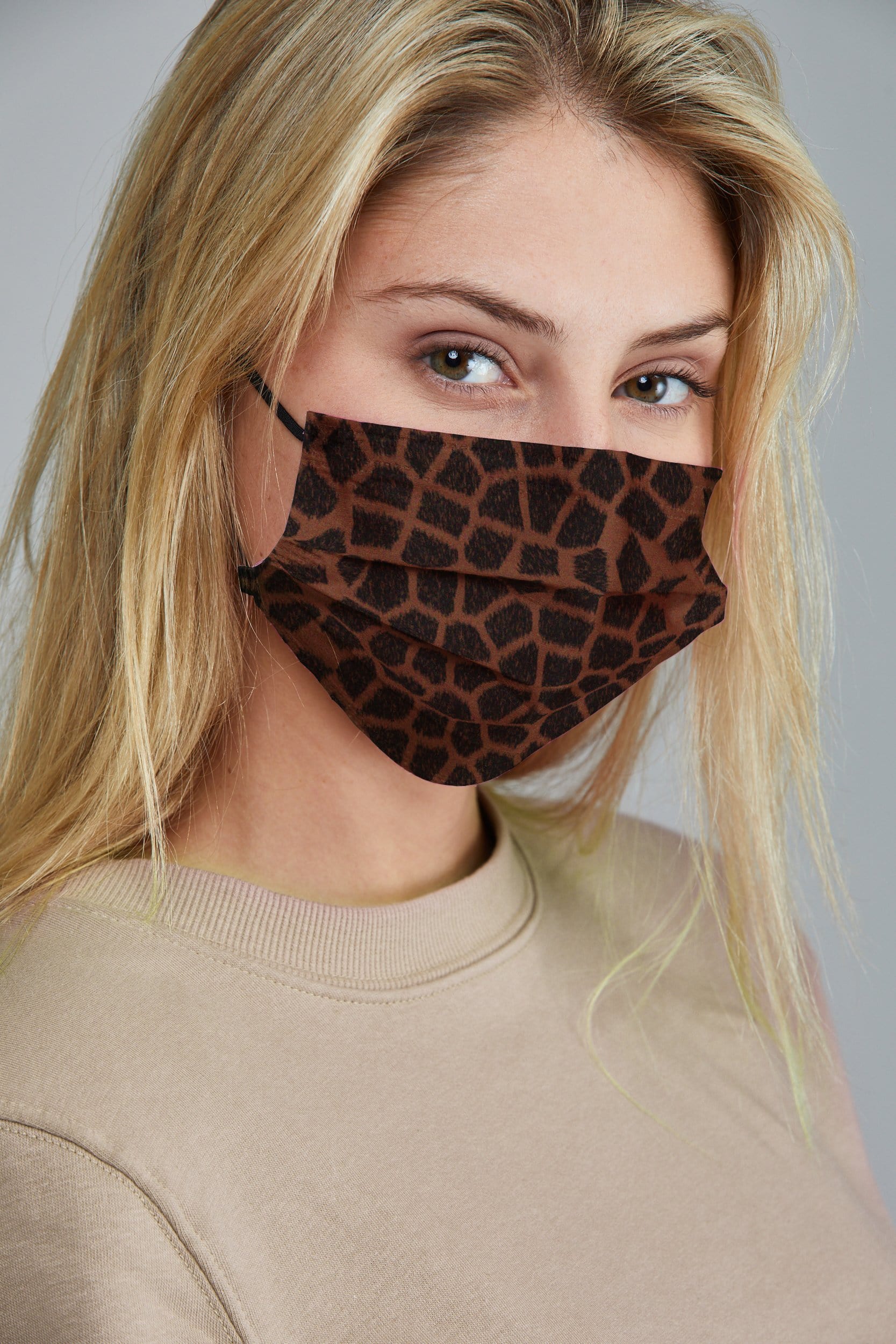 Woman wearing stylish Giraffe Printed Pleated face mask, with high quality breathable fabric. 