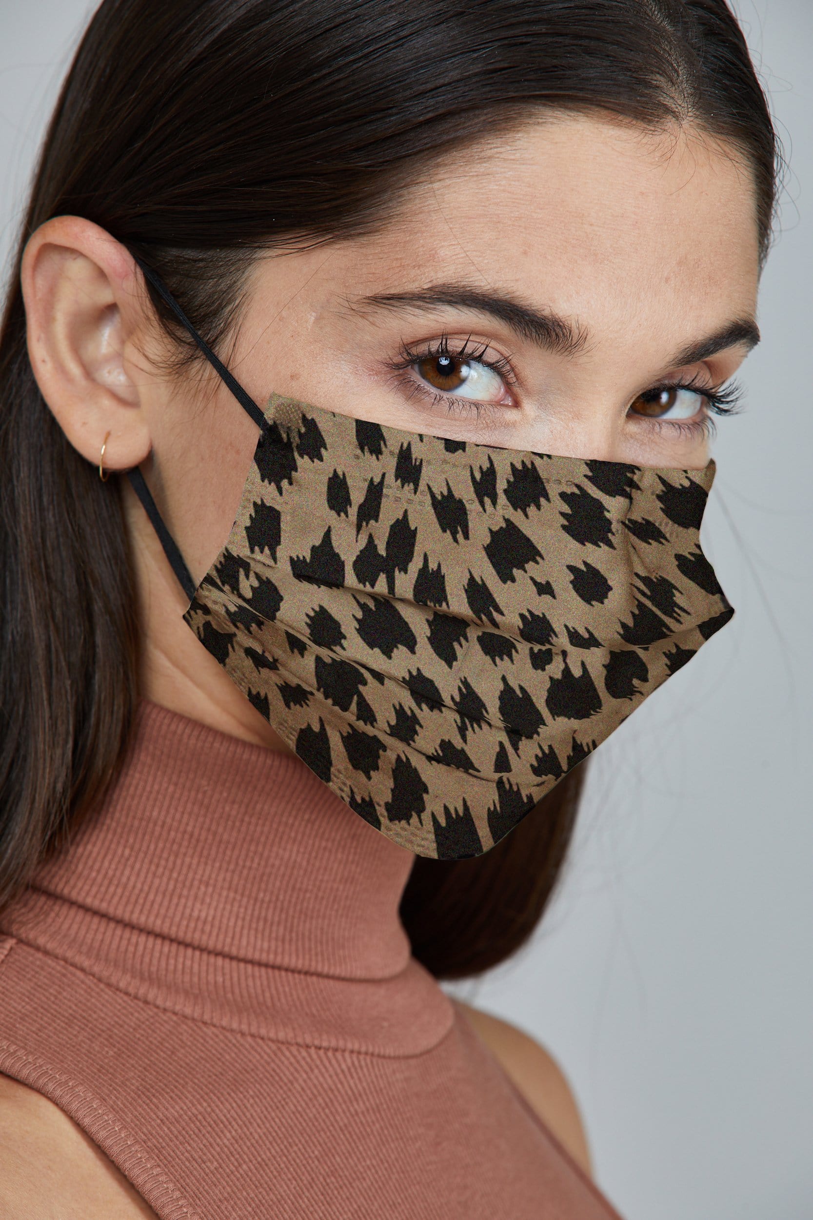 Woman wearing stylish Light Leopard Printed Pleated face mask, with high quality breathable fabric. 