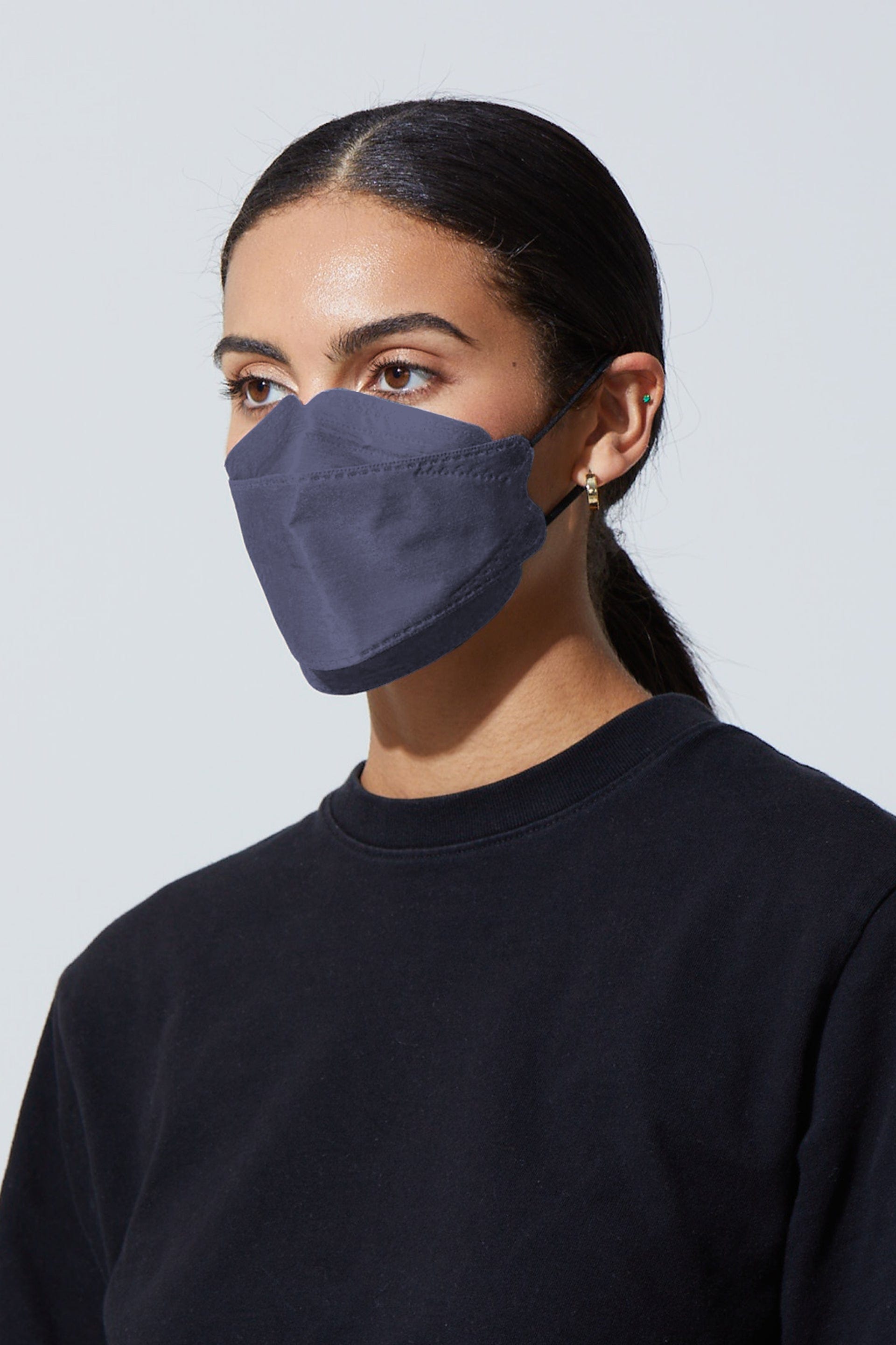 Woman wearing stylish Dark Blue KF94 face mask, with high quality breathable fabric. 