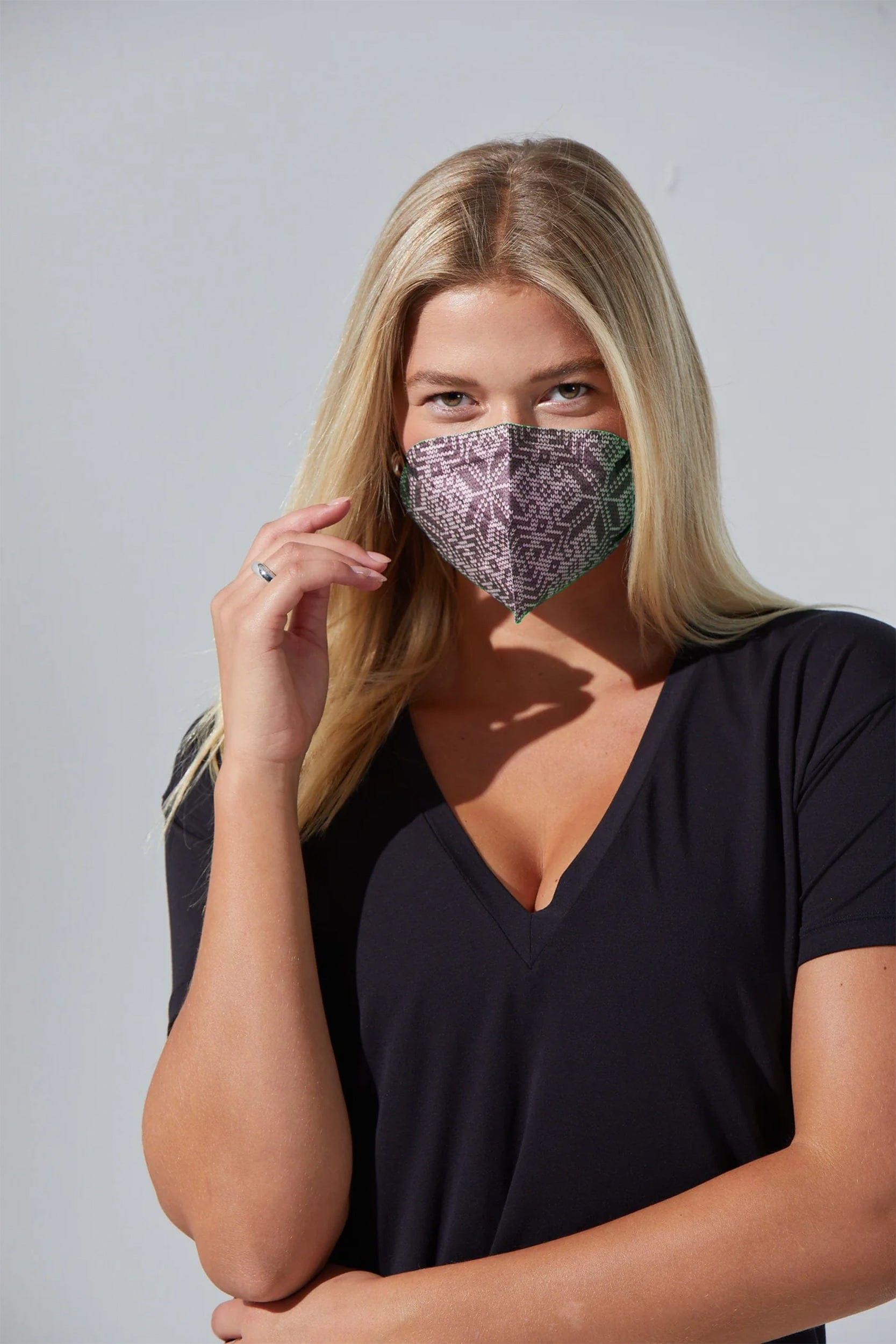 Woman wearing stylish Geometric Print KN95 face mask, with high quality breathable fabric. 
