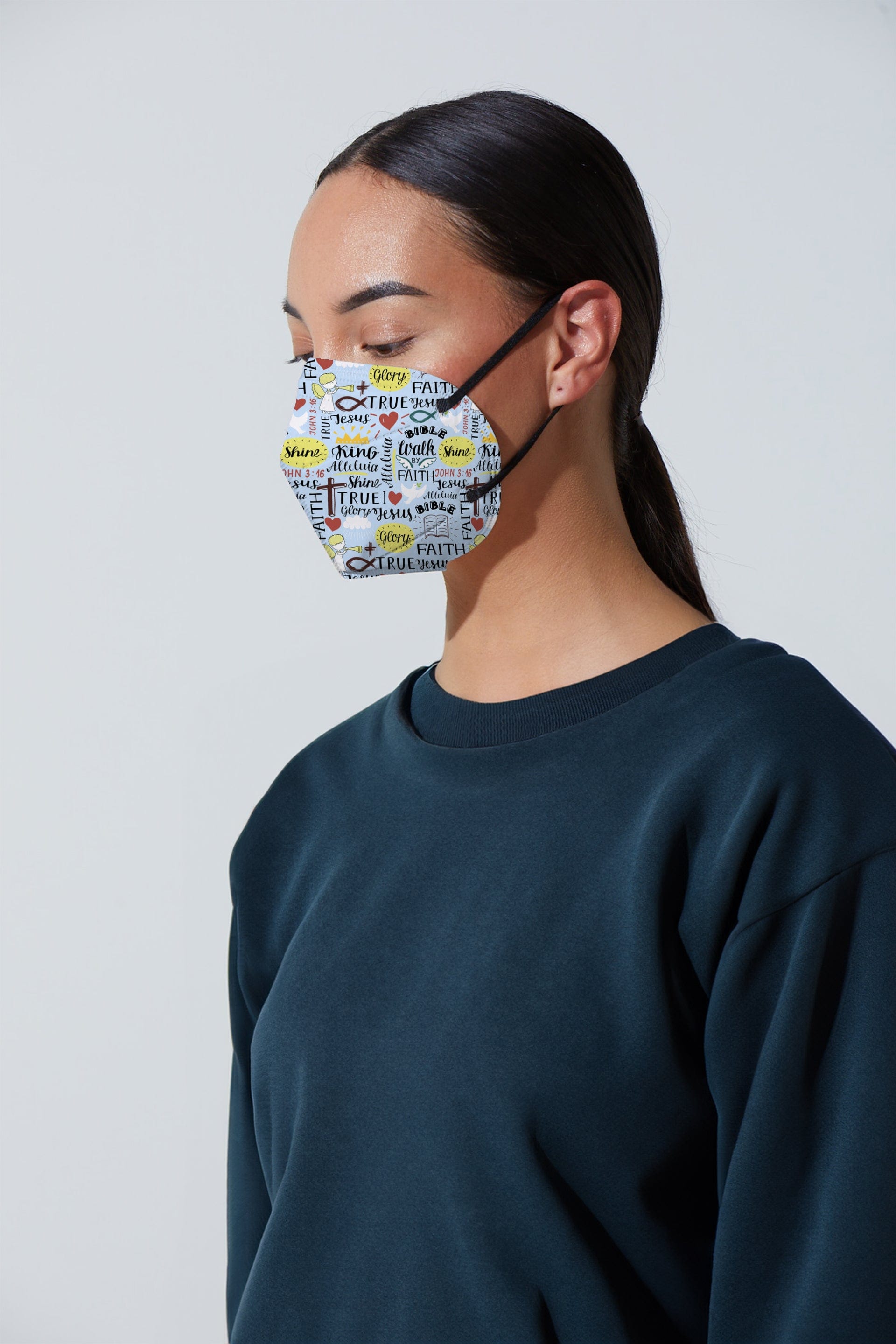Woman wearing stylish light blue Christian Faith printed KN95 face mask, with high quality breathable fabric. 