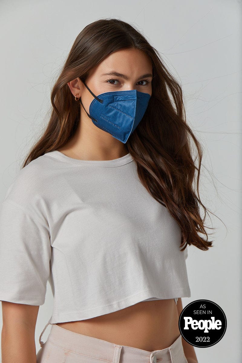 Woman wearing stylish Navy Blue KN95 face mask, with high quality breathable fabric. 