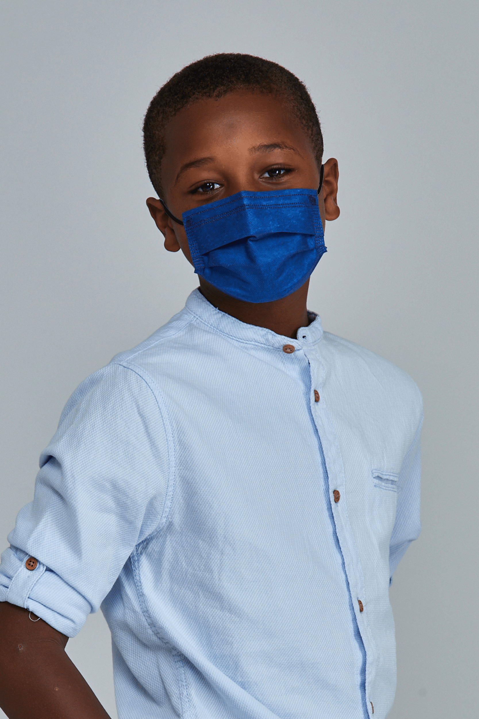 Child wearing stylish Navy Blue  Pleated face mask, with three layers & high quality breathable fabric. 